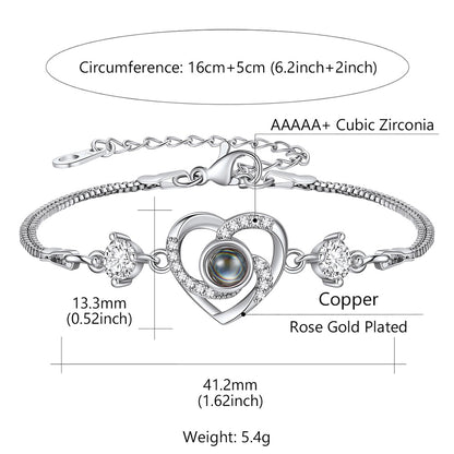 Silver heart photo projection bracelet with heart design and measurements on a white background