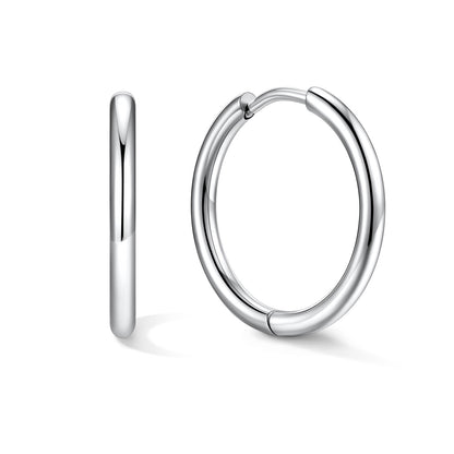 16mm Silver huggie earrings on a white background