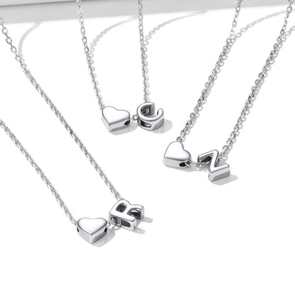 Silver initial heart necklaces with heart-shaped pendants 