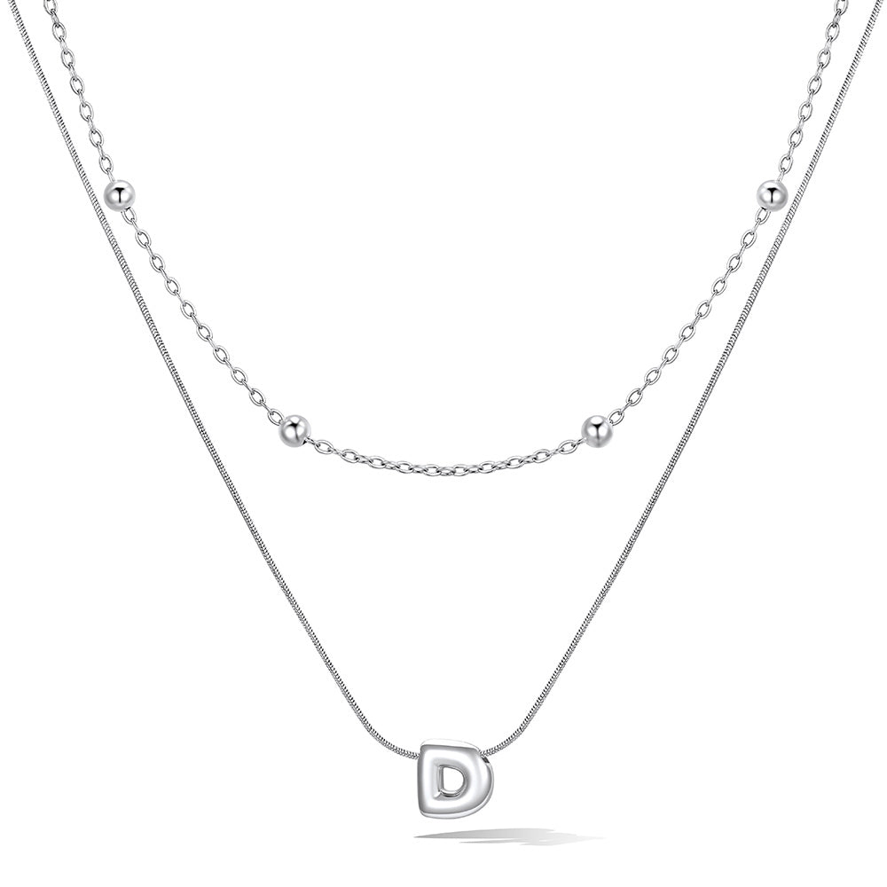 Silver layered initial D necklace, showing measurements and material details.