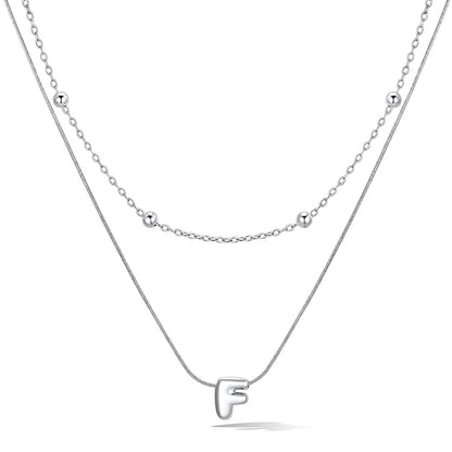 Silver layered initial F necklace, showing measurements and material details.