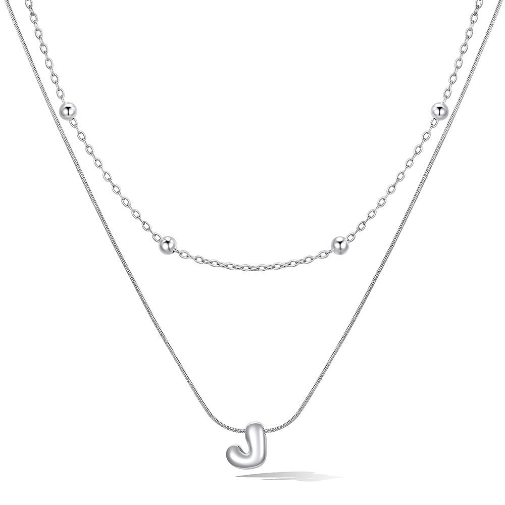 Silver layered initial J necklace, showing measurements and material details.