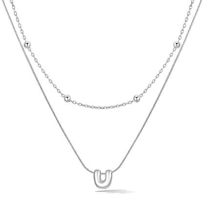 Silver layered initial U necklace, showing measurements and material details.