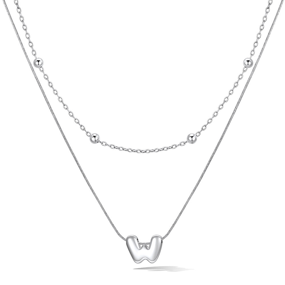 Silver layered initial W necklace, showing measurements and material details.