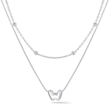 Silver layered initial W necklace, showing measurements and material details.