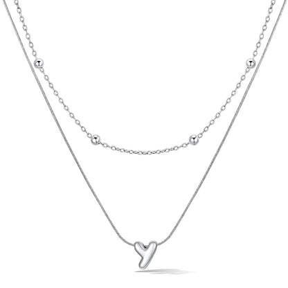 Silver layered initial Y necklace, showing measurements and material details.