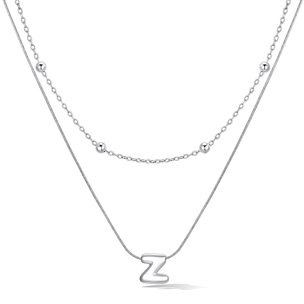Silver layered initial Z necklace, showing measurements and material details.