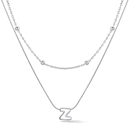Silver layered initial Z necklace, showing measurements and material details.
