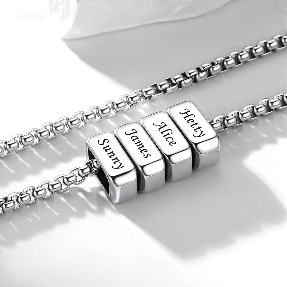 Silver multi name necklace with engraved name beads on a white background