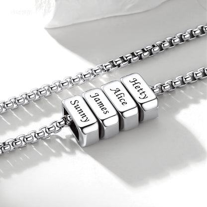 Silver multi name necklace with engraved name beads on a white background