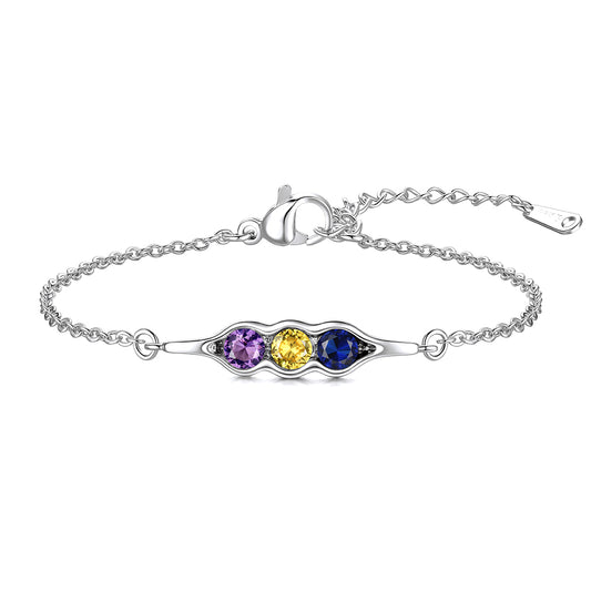 Silver pea in pot bracelet with three colored gemstones on a white background