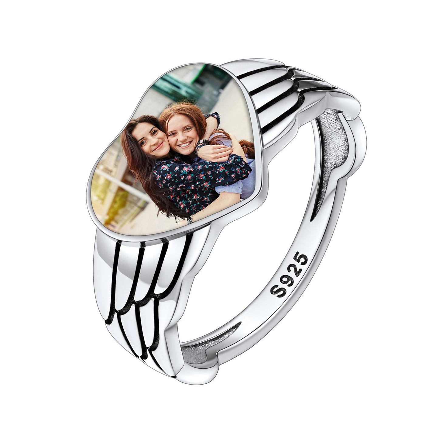Silver picture ring with a heart-shaped photo insert and '925' stamp on a white background