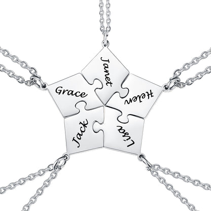 Silver puzzle piece necklace with engraved names on a white background