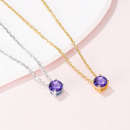 Solitaire Birthstone Necklace on a pink background