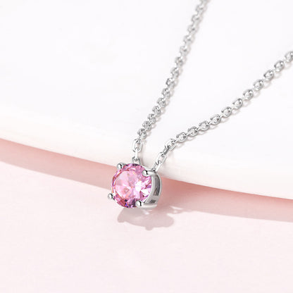 Solitaire Birthstone October Necklace on a pink background