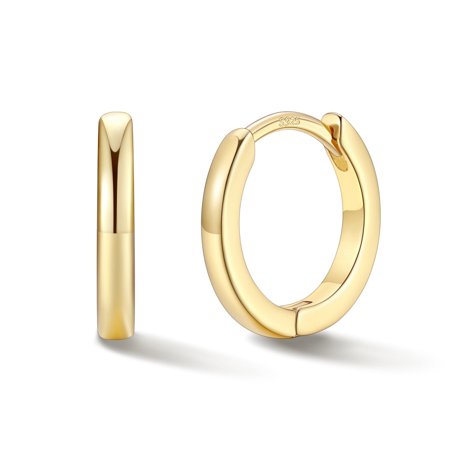 Gold hoop earrings on a white background