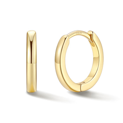 Gold hoop earrings on a white background