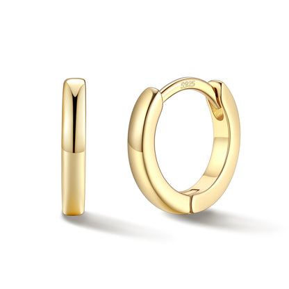 Gold hoop earrings on a white background