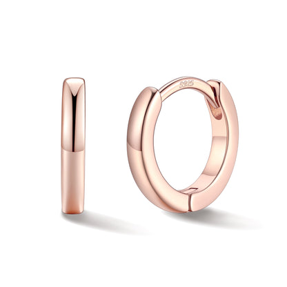 Rose gold hoop earrings on a white background