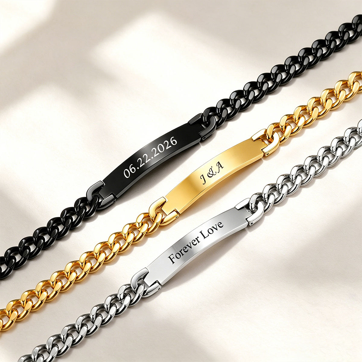 Three Cuban chain Necklace in black, gold, and silver on a light background