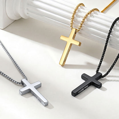 Three engraved cross necklaces in gold, silver, and black on a white background
