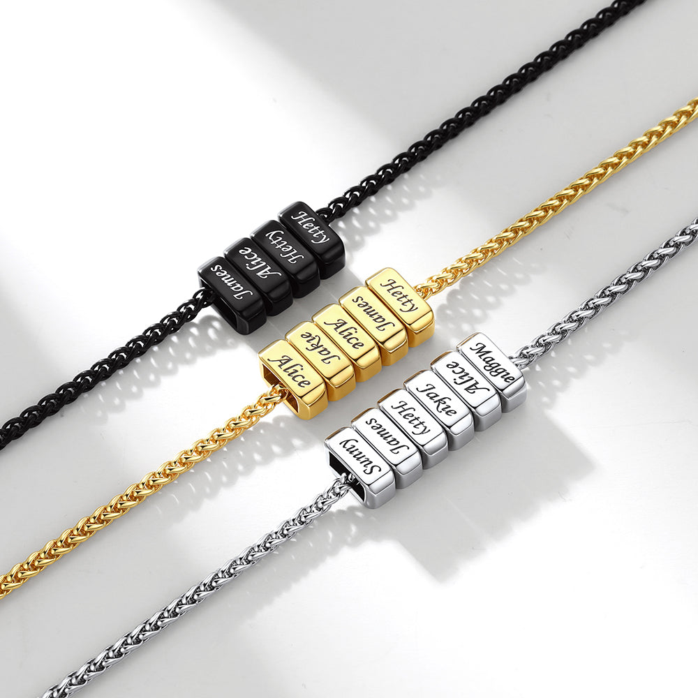Three multi name necklaces with engraved name beads on a light background