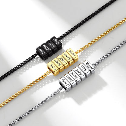 Three multi name necklaces with engraved name beads on a light background