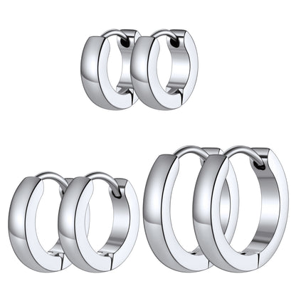 Three pairs of polished silver huggie hoop earrings shown in three sizes on a plain white background.