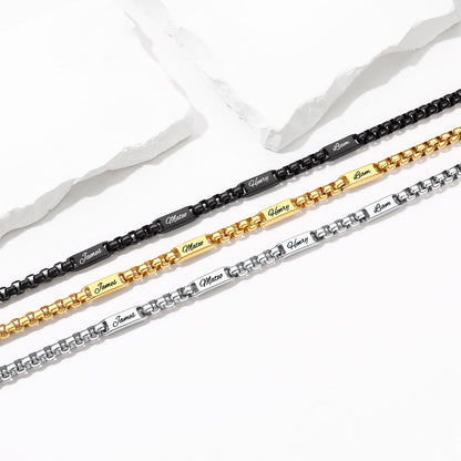 Three personalized name chains in black, gold, and silver, laid diagonally on a white background with decorative torn paper.