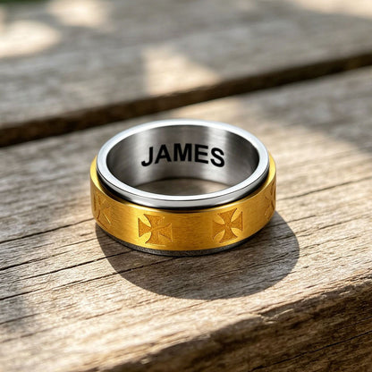 Two-tone Knights Templar ring with gold and silver colors on a wooden surface