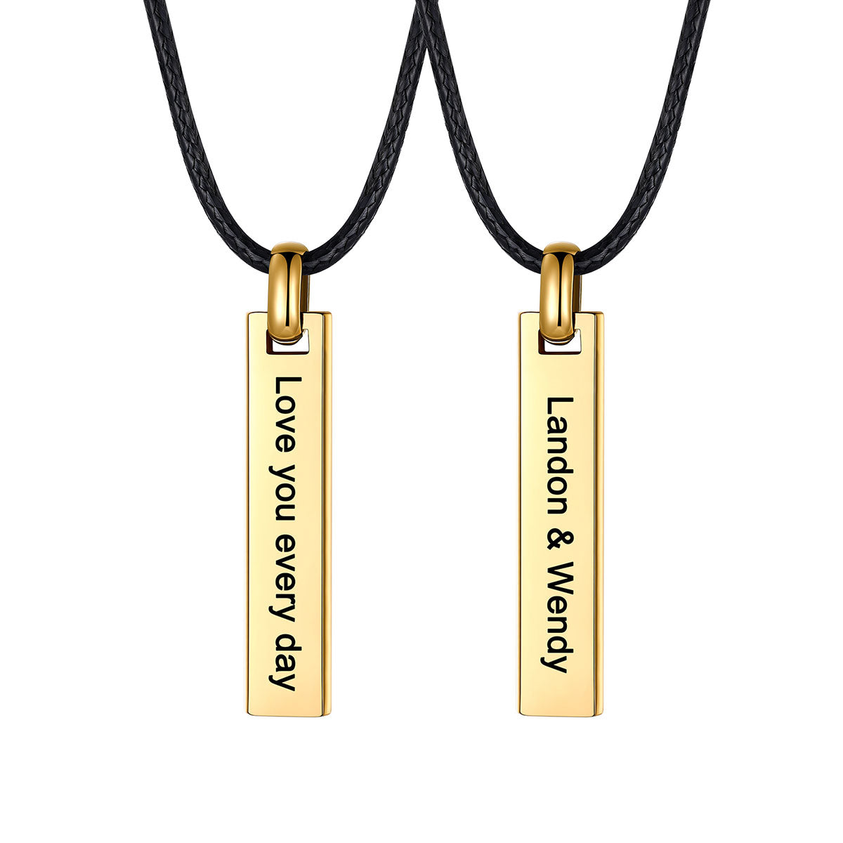 Two gold rectangular engraved bar pendant necklace on black cords, each engraved with personalized text, shown on a plain white background.