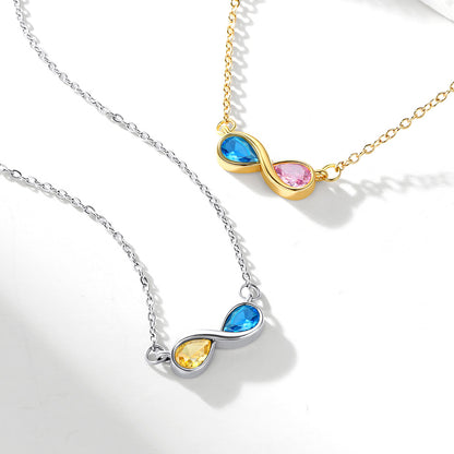Two infinity birthstone necklaces with colorful gemstones on a white background