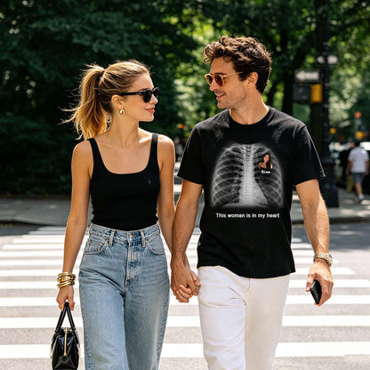 Two people holding hands on a crosswalk, one wearing a black custom text x ray t-shirt with an X-ray design.