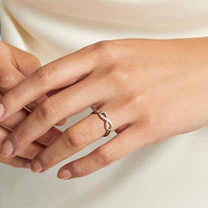 Woman Wearing Silver Simple Infinity Ring