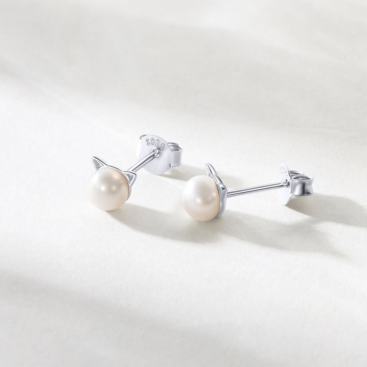 Women's 925 Sterling Silver Cat Pearl  Stud Earrings on a light grey background