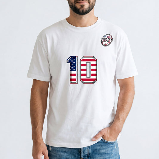 Person wearing a white t-shirt with a number 10 design on a plain background